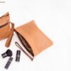 Burning sand leather pouch bag with intricate design and versatile usage