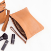 Burning sand leather pouch bag with intricate design and versatile usage